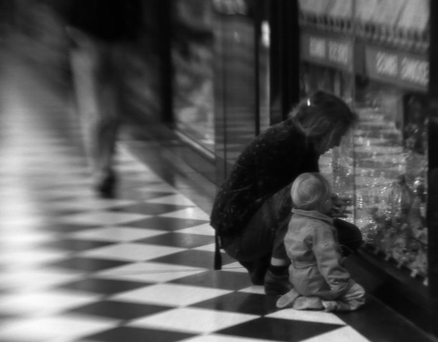 P1010533.jpg - When the shops are closed, we can only but dream.. as his dad watches on. Lens baby at night hand held.