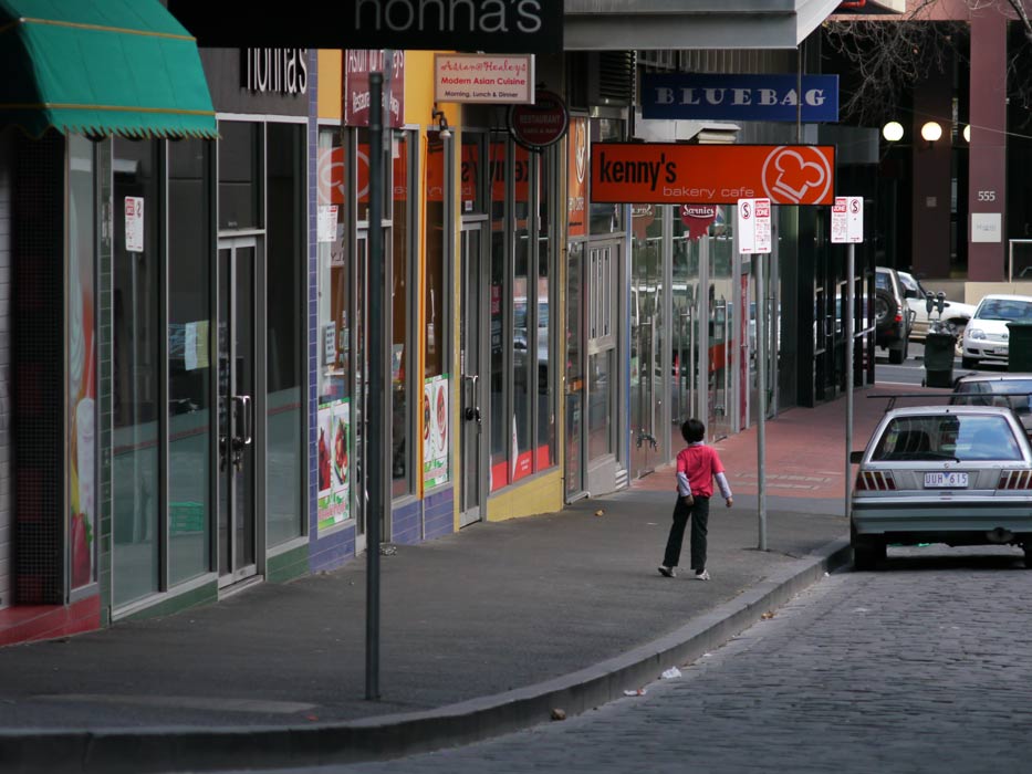 P1010723.jpg - Testing the 100mm Olympus OM lens. I was setting up for a shot here in this seemingly deserted street, when this kid appeared from nowhere and thought he better have a scratch - so he ended up in my photo too.