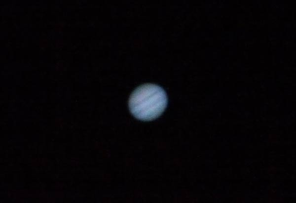 Jupiter_P1020172.jpg - Jupiter with Panasonic GH-1 at ISO 3200, 1/160th sec and f/11 (10" f/5.6 Newtonian + Olympus ZD EC-20 2x teleconverter) with poor seeing conditions. Diameter of Jupiter at opposition (48 arc secs) covers 124 pixels. Unfortunately, I accidentally shot in vibrant film mode and only jpeg which I am sure increased the contrast and made it's dimmer moons invisible.